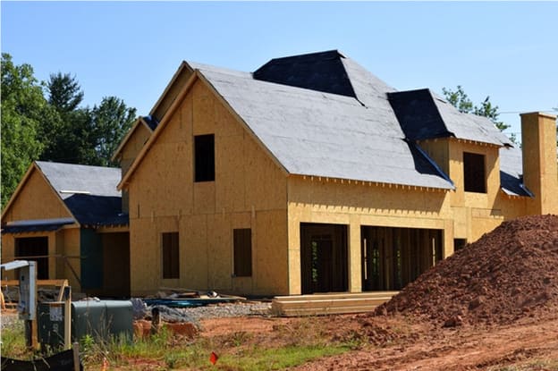 A bungalow under construction in Dallas, TX