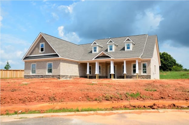 A bungalow in the center of the area being constructed depicting the causes of roof damage